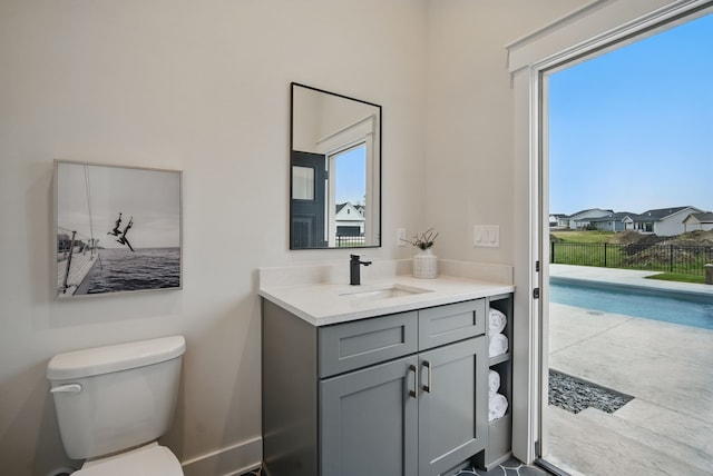 18167 Alderleaf Dr, Clive, IA 50325 - half bathroom featuring vanity, toilet, and plenty of natural light