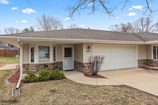 single story home featuring fence, roof with shingles, stone siding, driveway, and a garage