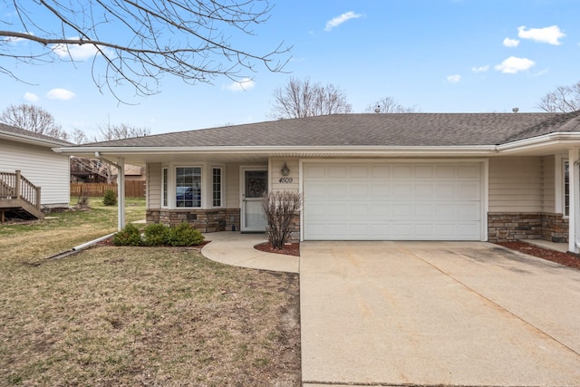 view of front of home with concrete driveway, an attached garage, stone siding, a front yard, and a shingled roof