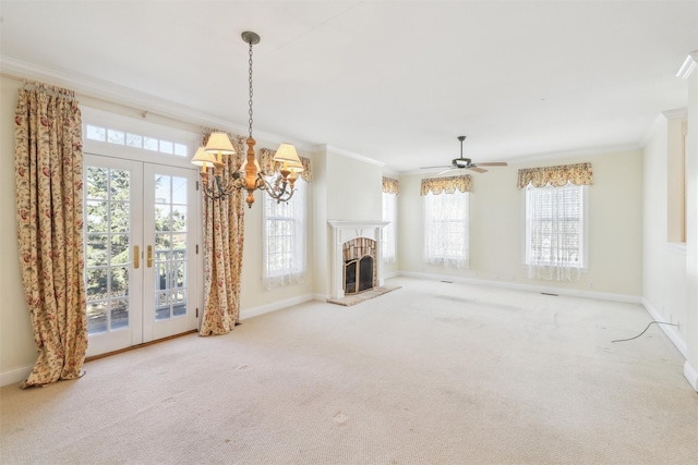unfurnished living room with carpet floors, ornamental molding, and baseboards
