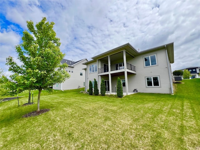 17595 Aurora Dr, Clive, IA 50325 - back of property featuring a balcony and a lawn