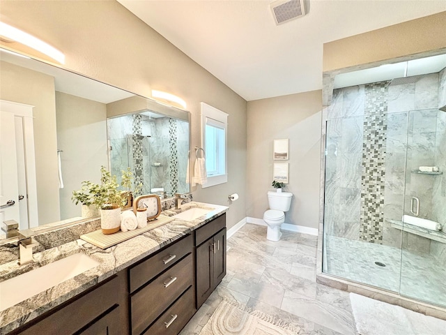 17595 Aurora Dr, Clive, IA 50325 - full bath featuring double vanity, a shower stall, toilet, baseboards, and marble look tiles