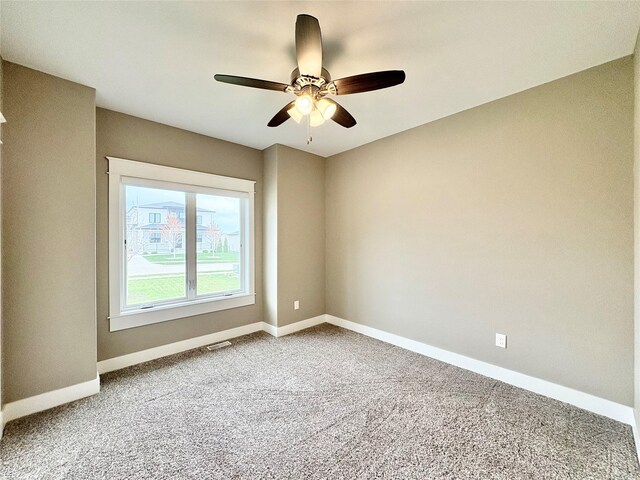17595 Aurora Dr, Clive, IA 50325 - empty room featuring ceiling fan, carpet flooring, and baseboards