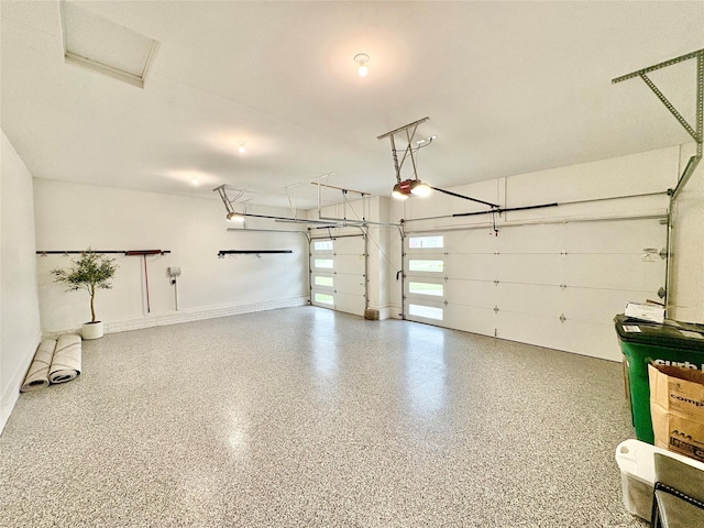 17595 Aurora Dr, Clive, IA 50325 - garage with a garage door opener and baseboards