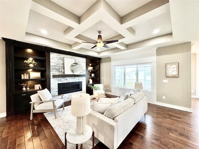 17595 Aurora Dr, Clive, IA 50325 - living area with dark wood finished floors, coffered ceiling, a glass covered fireplace, baseboards, and ceiling fan