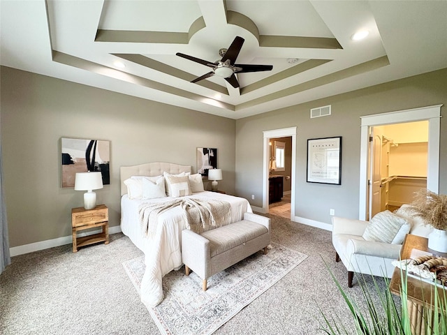 17595 Aurora Dr, Clive, IA 50325 - bedroom with a raised ceiling, light carpet, baseboards, ensuite bathroom, and a spacious closet