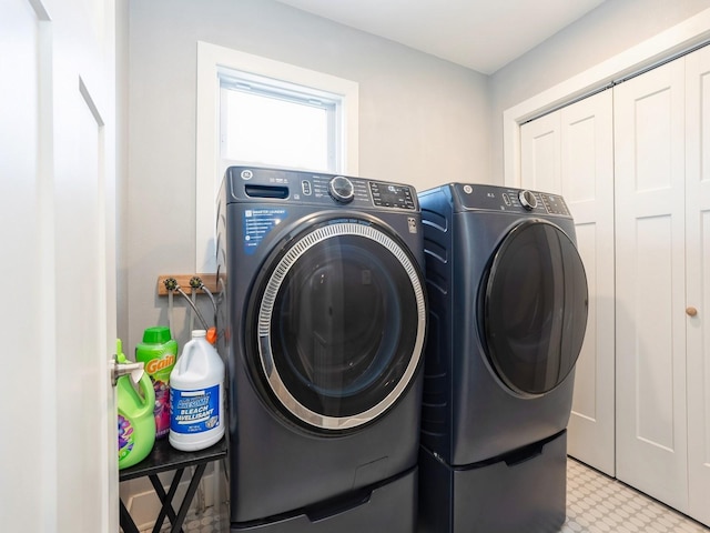 613 E 8th St N, Newton, IA 50208 - washroom with washer and dryer and tile patterned floors