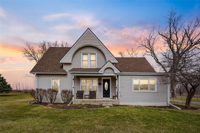 321 W Maple St, Roland, IA 50236 - view of front of home with a lawn, covered porch, and a shingled roof