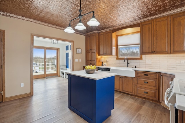 321 W Maple St, Roland, IA 50236 - kitchen featuring an ornate ceiling, tasteful backsplash, stove, and a sink