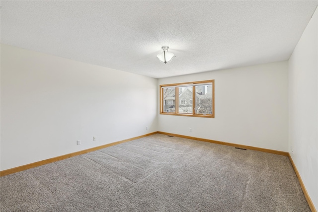 811 Burr Oaks Dr Unit 1110, West Des Moines, IA 50266 - carpeted spare room featuring baseboards and a textured ceiling