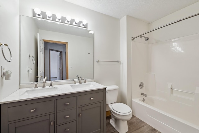 811 Burr Oaks Dr Unit 1110, West Des Moines, IA 50266 - full bathroom with wood finished floors, double vanity, tub / shower combination, and a textured ceiling