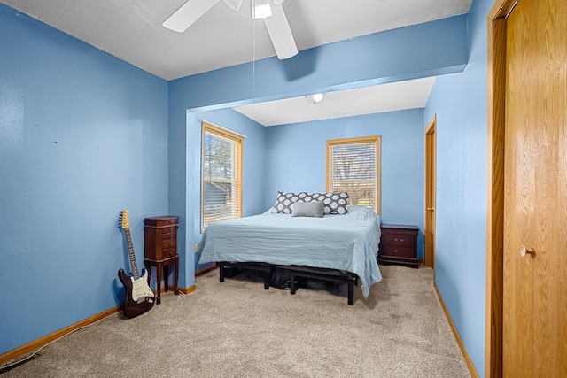 400 Center Ave S, Mitchellville, IA 50169 - bedroom with carpet floors, baseboards, and ceiling fan