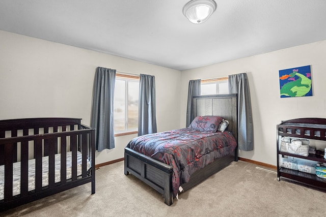 400 Center Ave S, Mitchellville, IA 50169 - carpeted bedroom featuring baseboards