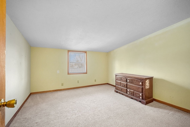400 Center Ave S, Mitchellville, IA 50169 - unfurnished bedroom featuring carpet flooring and baseboards