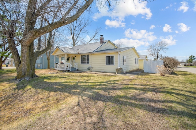 400 Center Ave S, Mitchellville, IA 50169 - view of front of home with a porch, a chimney, and metal roof