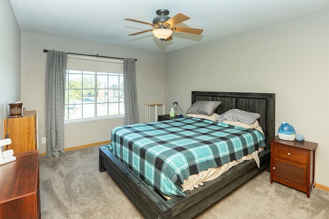 2819 Ashland Ct, Altoona, IA 50009 - carpeted bedroom featuring baseboards and a ceiling fan