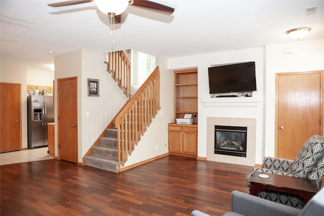 2819 Ashland Ct, Altoona, IA 50009 - living room featuring ceiling fan, stairs, wood finished floors, and a fireplace