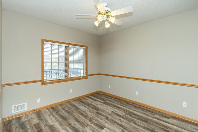 1325 SE Florence Dr Unit 207, Waukee, IA 50263 - unfurnished room featuring wood finished floors, a ceiling fan, and baseboards