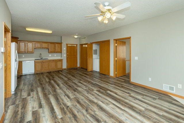 1325 SE Florence Dr Unit 207, Waukee, IA 50263 - kitchen featuring white appliances, a sink, dark wood-style floors, a ceiling fan, and light countertops