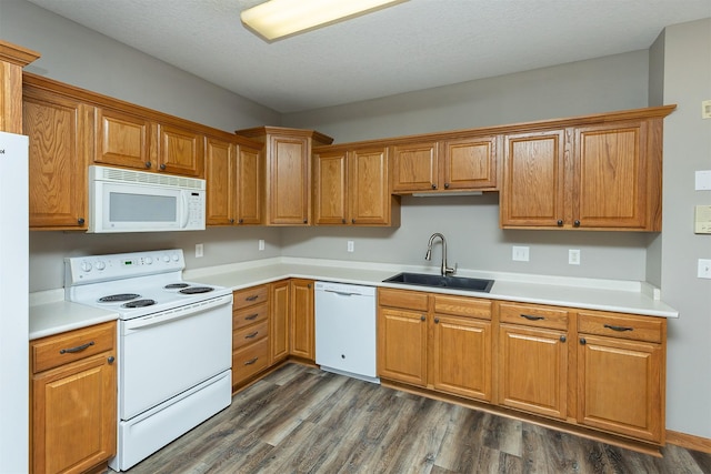 1325 SE Florence Dr Unit 207, Waukee, IA 50263 - kitchen with white appliances, a sink, dark wood finished floors, and light countertops