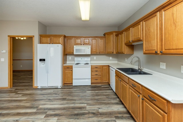 1325 SE Florence Dr Unit 207, Waukee, IA 50263 - kitchen with white appliances, a sink, dark wood-style floors, light countertops, and a textured ceiling