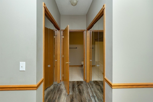 1325 SE Florence Dr Unit 207, Waukee, IA 50263 - hallway with wood finished floors and baseboards