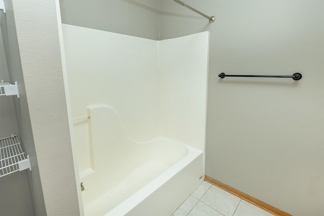 1325 SE Florence Dr Unit 207, Waukee, IA 50263 - bathroom with tile patterned floors, baseboards, and washtub / shower combination
