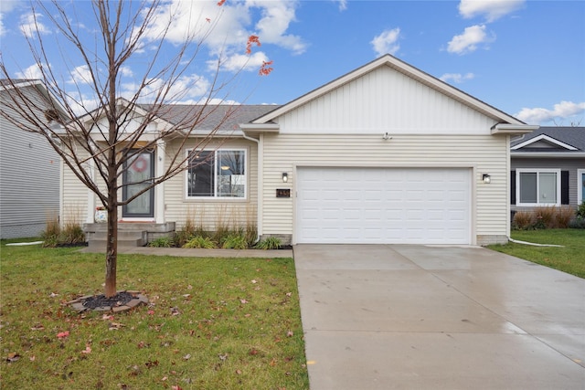 ranch-style home featuring a front yard, concrete driveway, and an attached garage