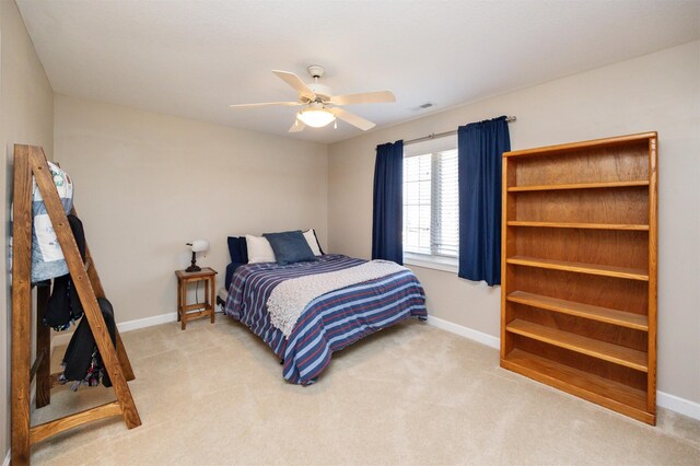 4611 153rd St, Urbandale, IA 50323 - bedroom with baseboards, light colored carpet, and ceiling fan