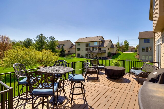 4611 153rd St, Urbandale, IA 50323 - wooden terrace with a residential view and a lawn