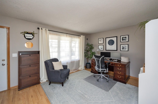15026 Hawthorn Dr, Clive, IA 50325 - office featuring wood finished floors and baseboards