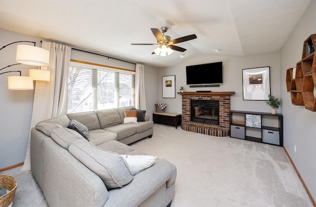 15026 Hawthorn Dr, Clive, IA 50325 - living room featuring light colored carpet, a ceiling fan, vaulted ceiling, baseboards, and a fireplace