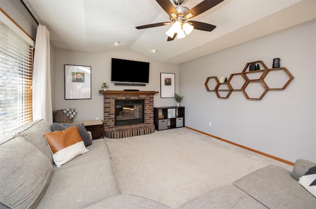 15026 Hawthorn Dr, Clive, IA 50325 - living room with lofted ceiling, a ceiling fan, a brick fireplace, baseboards, and carpet flooring