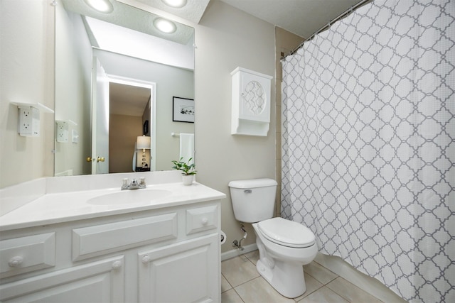 15026 Hawthorn Dr, Clive, IA 50325 - full bath featuring tile patterned floors, toilet, and vanity