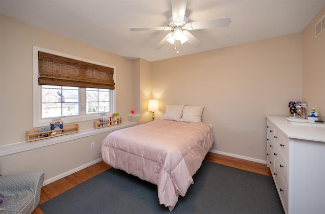 15026 Hawthorn Dr, Clive, IA 50325 - bedroom featuring wood finished floors, baseboards, and ceiling fan