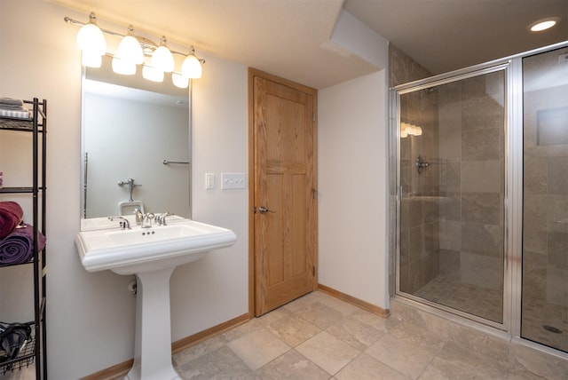 4328 125th St, Urbandale, IA 50323 - full bathroom featuring a stall shower, baseboards, and recessed lighting
