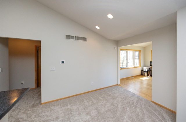 4328 125th St, Urbandale, IA 50323 - spare room featuring carpet, baseboards, recessed lighting, and vaulted ceiling