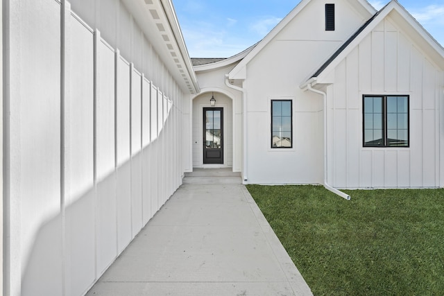 1284 NW 29th Ct, Grimes, IA 50111 - entrance to property featuring board and batten siding and a lawn
