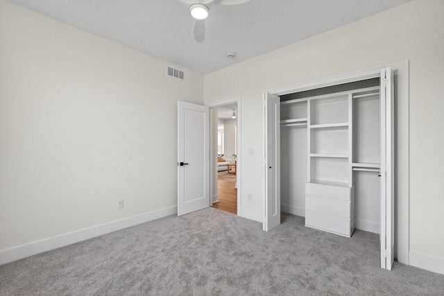 1284 NW 29th Ct, Grimes, IA 50111 - unfurnished bedroom featuring carpet flooring, a closet, and a ceiling fan