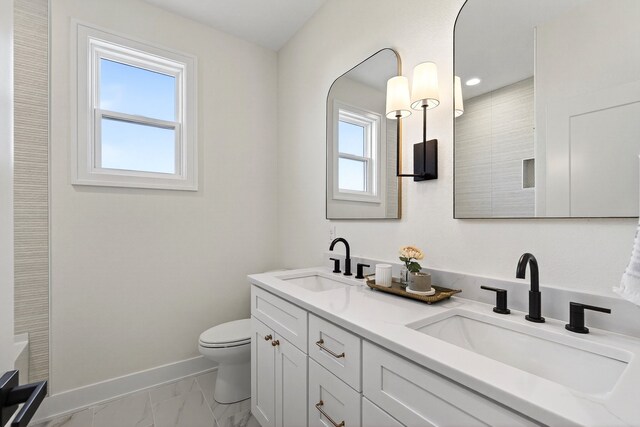 1284 NW 29th Ct, Grimes, IA 50111 - full bathroom featuring double vanity, marble finish flooring, and recessed lighting