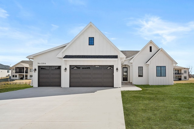 1284 NW 29th Ct, Grimes, IA 50111 - modern farmhouse style home featuring board and batten siding, concrete driveway, a front lawn, a garage, and roof with shingles