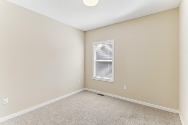 7821 NW 96th St, Johnston, IA 50131 - spare room featuring light colored carpet and baseboards