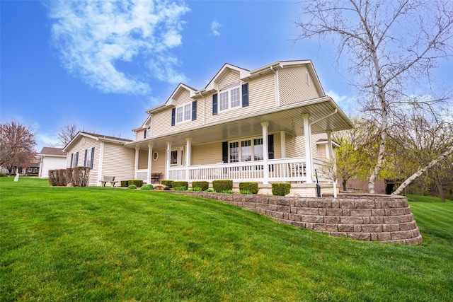 country-style home with a front yard and covered porch