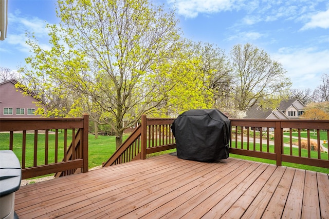 deck with a lawn and a grill