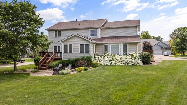 4850 Augusta Ln, Pleasant Hill, IA 50327 - rear view of house featuring stairs, a yard, and a wooden deck