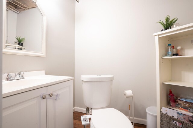 200 Space Ave SW, Mitchellville, IA 50169 - bathroom with toilet, vanity, and baseboards