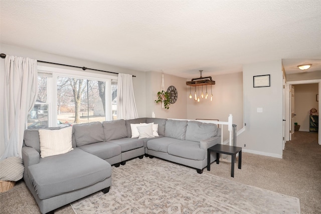 200 Space Ave SW, Mitchellville, IA 50169 - living area featuring a textured ceiling, carpet floors, and baseboards