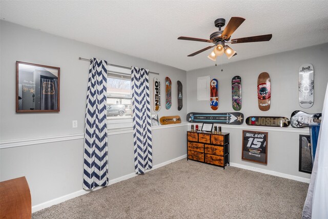 200 Space Ave SW, Mitchellville, IA 50169 - carpeted bedroom with a textured ceiling, a ceiling fan, and baseboards