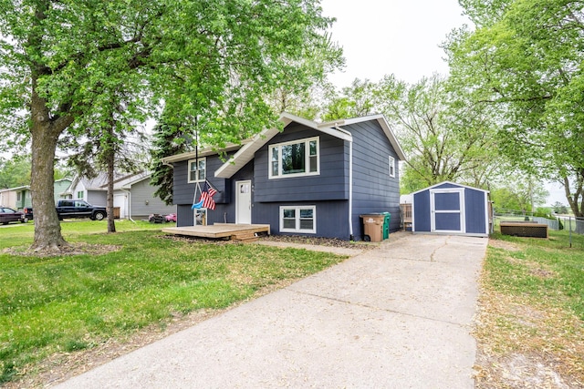 200 Space Ave SW, Mitchellville, IA 50169 - raised ranch with a storage shed, driveway, an outbuilding, a front lawn, and a deck