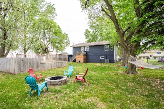 200 Space Ave SW, Mitchellville, IA 50169 - view of yard featuring an outdoor fire pit, stairs, and a deck